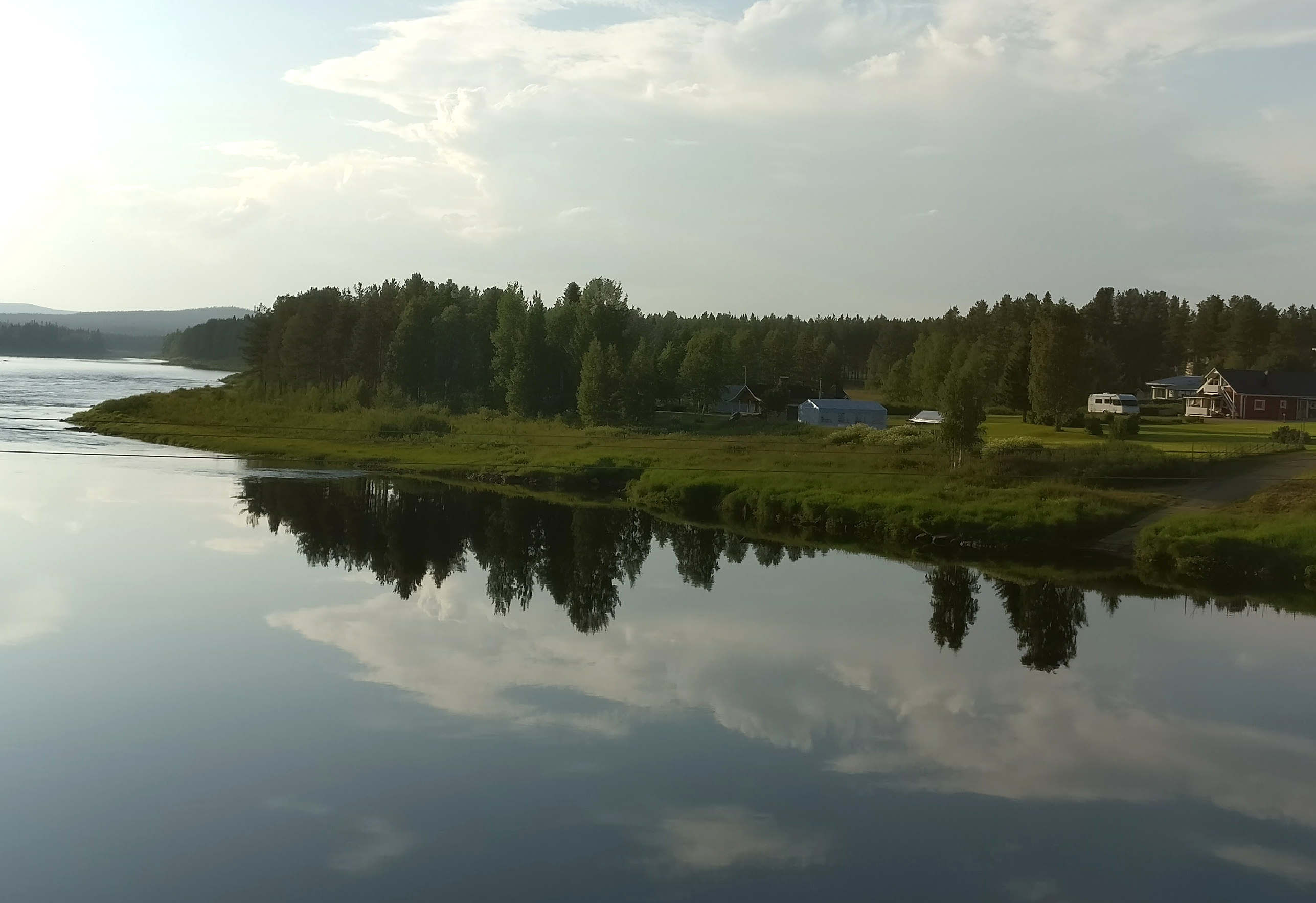 River Kemijoki view with the guesthouse in the middle on right