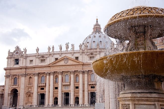 Fountain on St. Peter`s square and St. Peter's basilica, Vatican, center of Rome