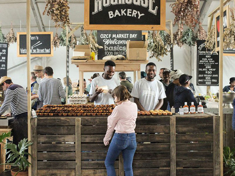 Handcrafted treats and friendly vendors create an inviting atmosphere in Greenmarket Square.