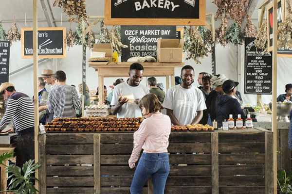 Handcrafted treats and friendly vendors create an inviting atmosphere in Greenmarket Square.