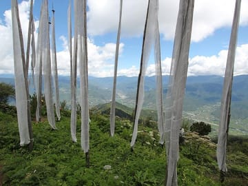 Prayers flags hoisted on serene hilltop