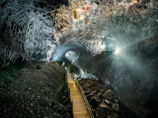 Despite the dark subterranean environment, lighting features provide a wonderful view of the pathway.