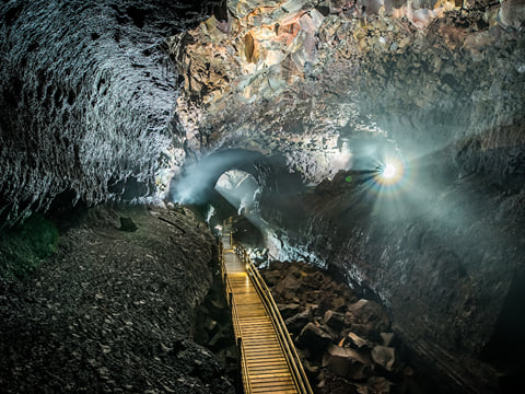 Despite the dark subterranean environment, lighting features provide a wonderful view of the pathway.