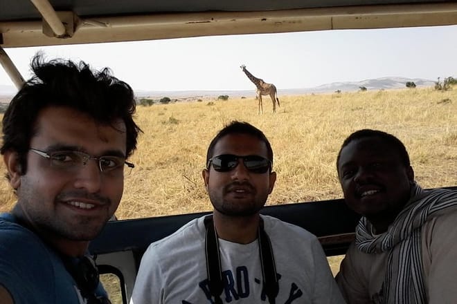 Game drives in a customized safari vehicle with pop up roof for easy game viewing