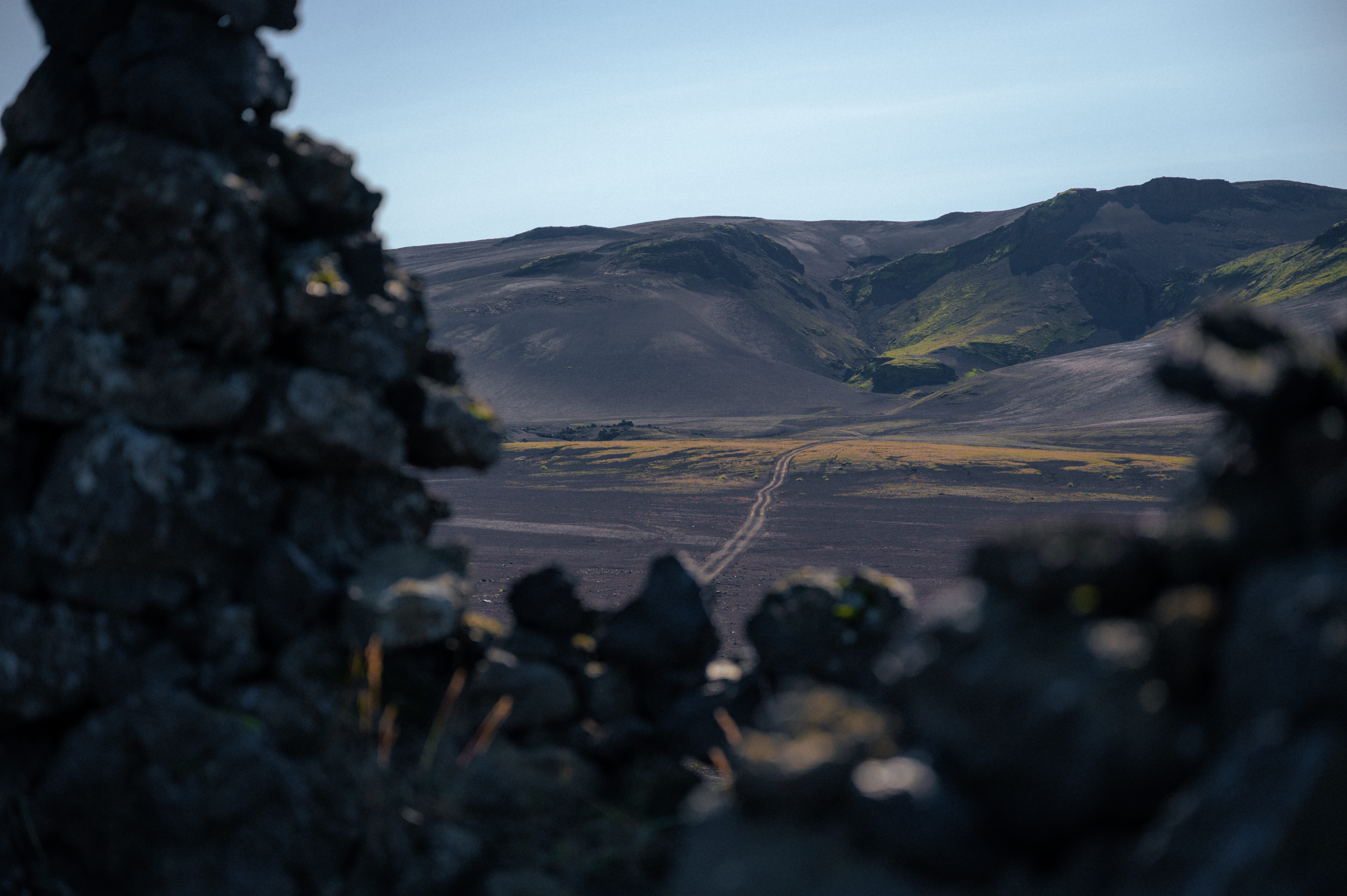 View of the rugged Landmannalaugar highlands through ancient lava formations during a private expedition