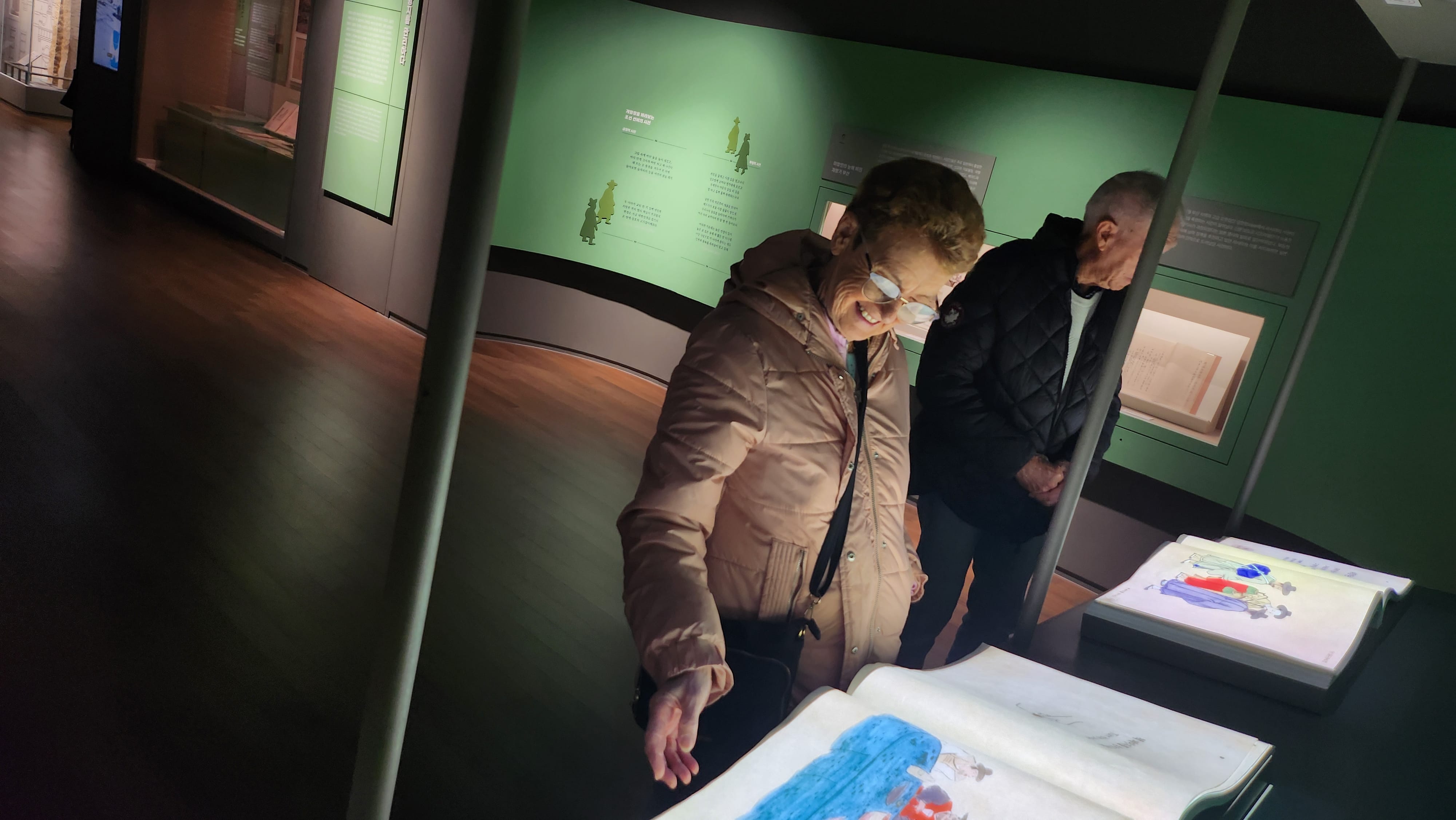 Visitors viewing exhibits inside the Busan Modern and Contemporary History Museum, learning about the city’s history and culture