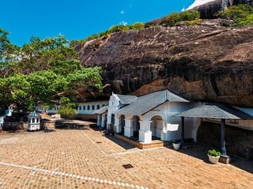 Discover the historic Dambulla Cave Temple, featuring centuries-old Buddha statues, vibrant murals, and panoramic views of the surrounding countryside.