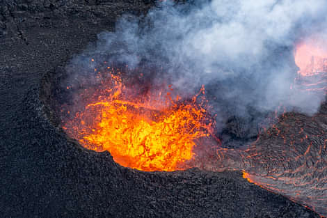 Volcanic crater bubbling with lava