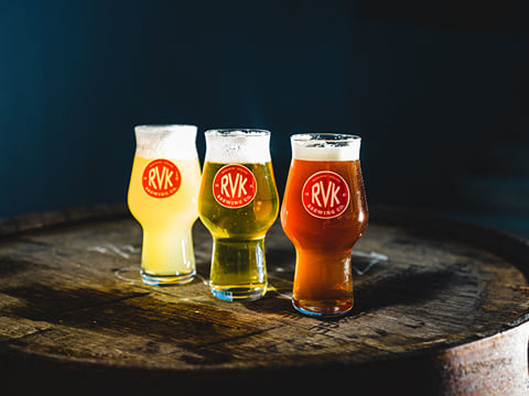 3 different types of beer in glasses on a platter