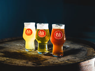 3 different types of beer in glasses on a platter
