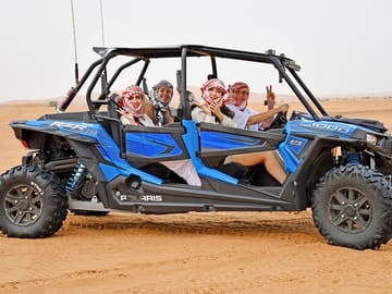 Short Desert Tour with Quad Bike Camel Ride Sandboard & Sunset