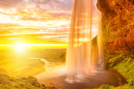 Seljalandsfoss on the South Coast in Iceland. Midnight sun.