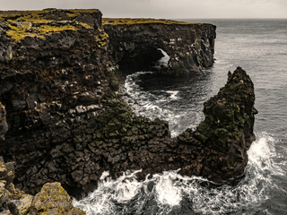 Svörtuloft black lava sea cliffs and arch