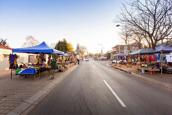 Explore vibrant Soweto street markets filled with local artistry and everyday life.