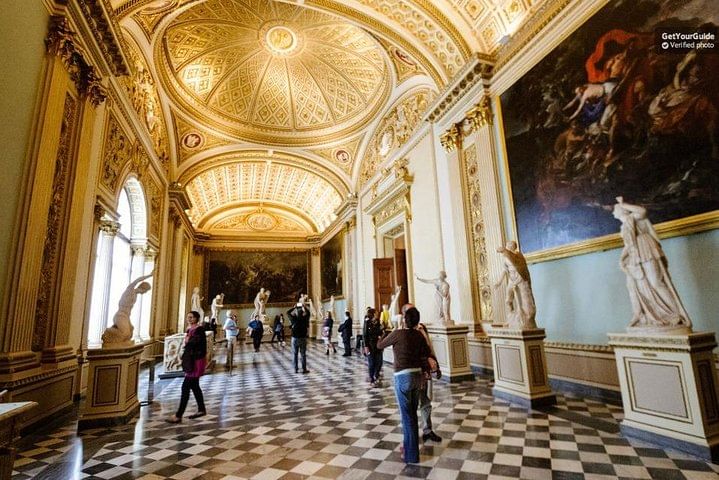 One of the corridors inside the Uffizi Gallery with paintings and sculptures on display 