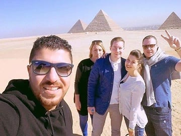 Uncover pyramids of giza with camel ride experience