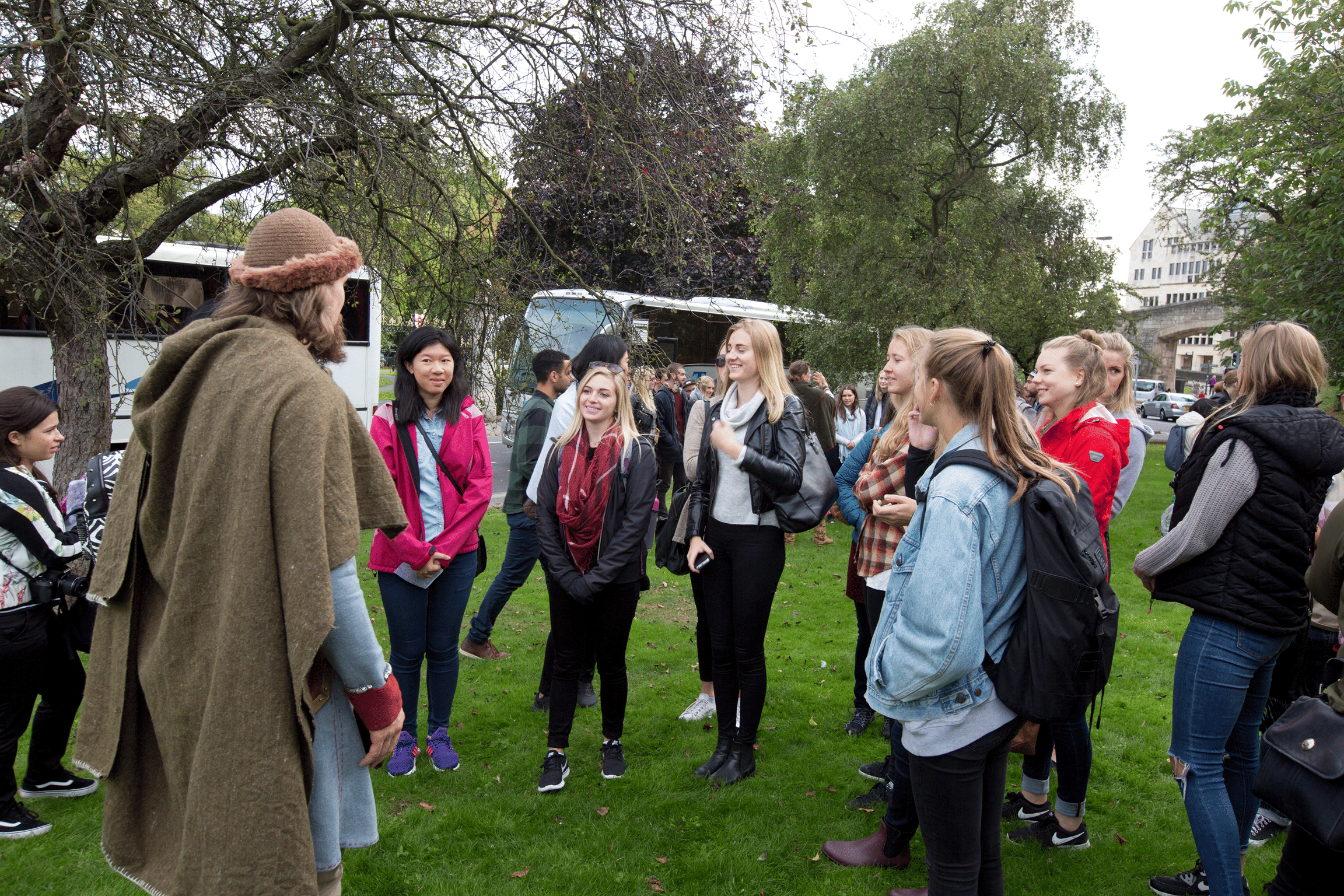 A viking guide about to start a tour of York, with a large group of international students.