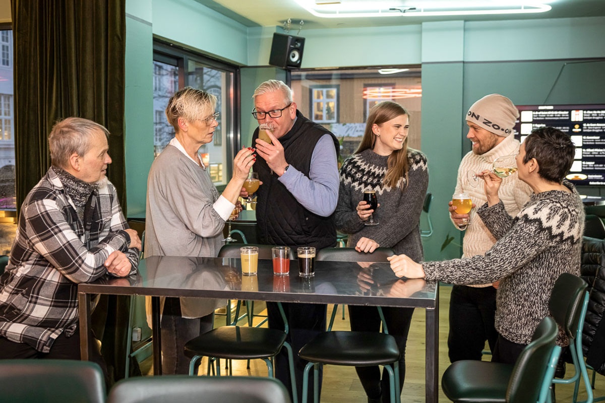 A group of guests sampling different delicious beers during The Reykjavik Beer & Booze Tour