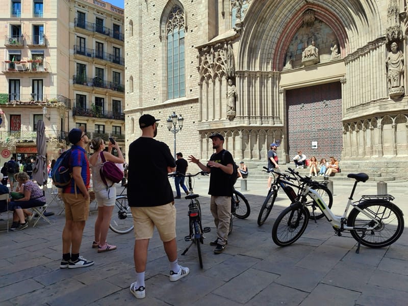The group with their bikes in front of Barcelona Cathedral