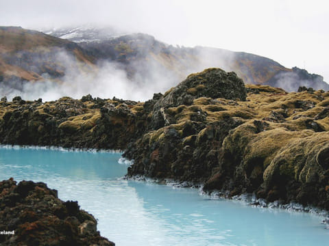 Blue water through lava fields