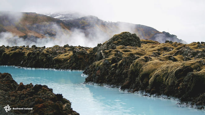 Blue water through lava fields