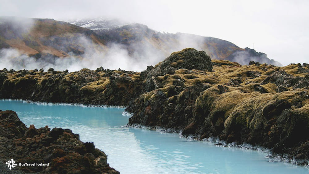 Blue water through lava fields