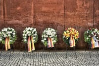 he wall not only split Berlin and Germany in two, Its demolition also represented the end of the Cold War. Not only did it separate economic and government systems it also divided families and friends