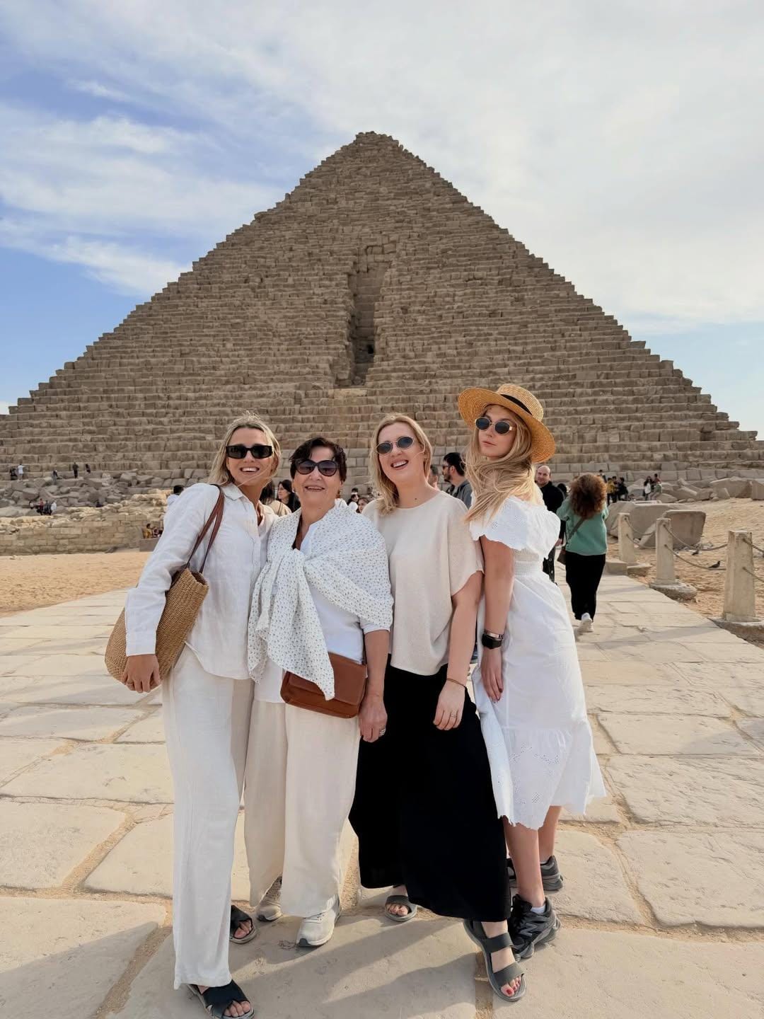 Family photo in front of Menkaure pyramid on a Cairo cultural heritage tour.