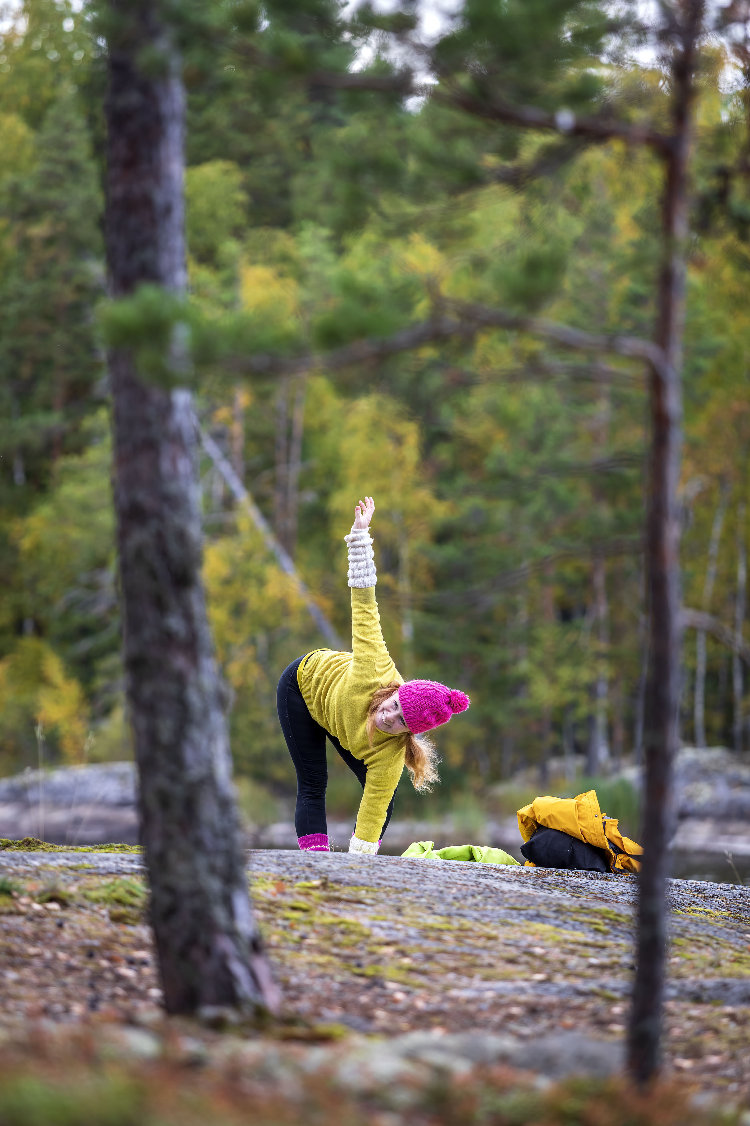 A woman exercising yoga outdoors