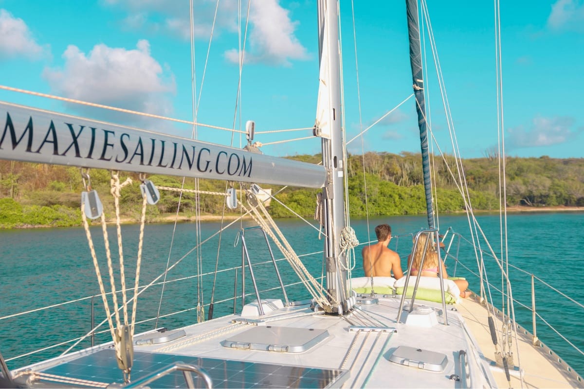 Sailing yacht Galaxie anchored in blue waters of beautiful Fuik Bay in Curacao