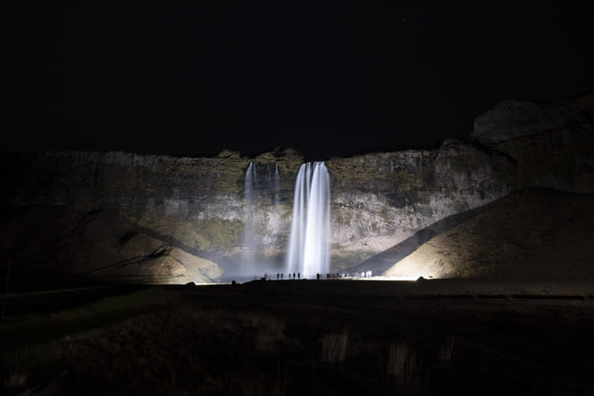 Seljalandsfoss waterfall showing off after dark
