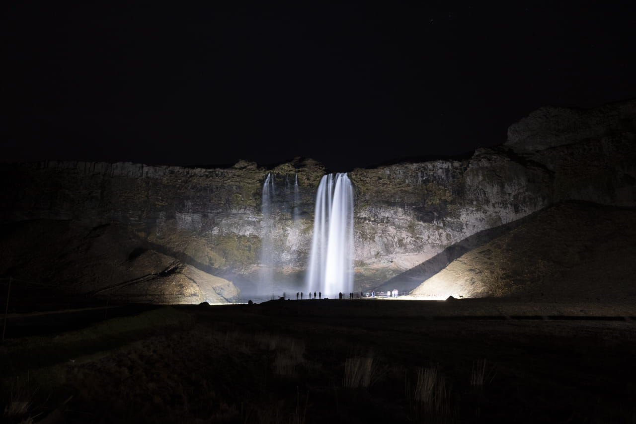 Seljalandsfoss waterfall showing off after dark