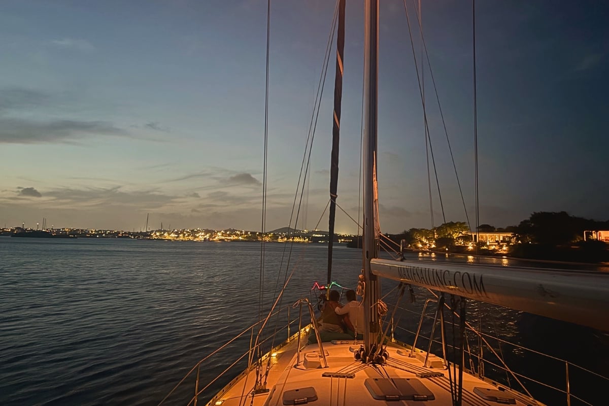 couple enjoying relaxing on sailing yacht galaxie at evening at Spanish Waters