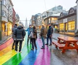 A group enjoying the Reykjavik Walking Tour by the Rainbow street