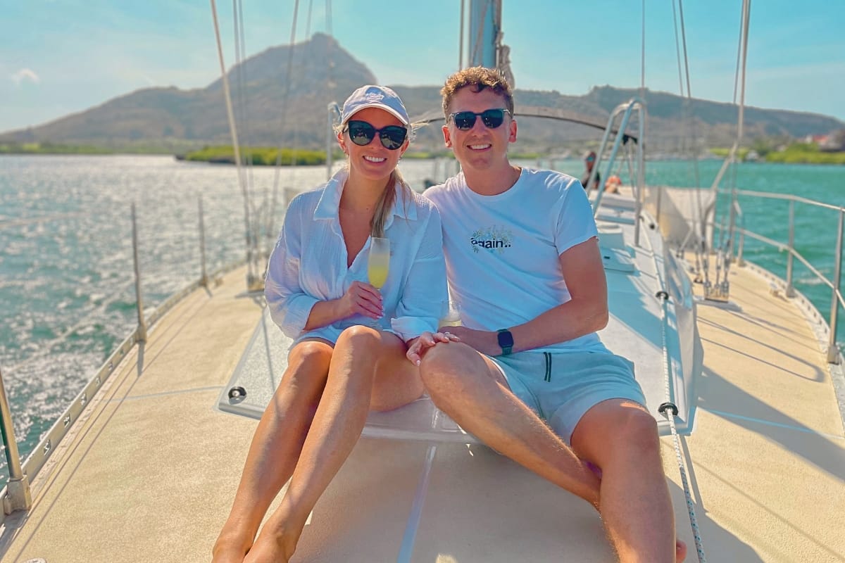 Happy couple enjoying private luxury morning tour on sailing yacht with Maxie Sailing Curacao