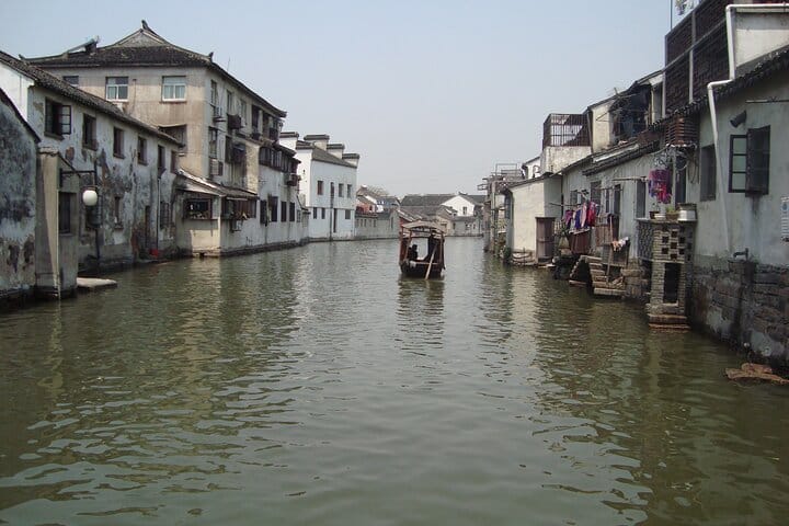 Shanghai to Suzhou by bullet train visit gardens and canal tour.