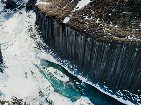 Standing at the edge of Stuðlagil, where the contrast of rock and river stuns every time.