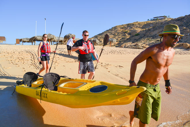 kayak Los Cabos guide carrying kayak beach end of tour smooth experience Baja