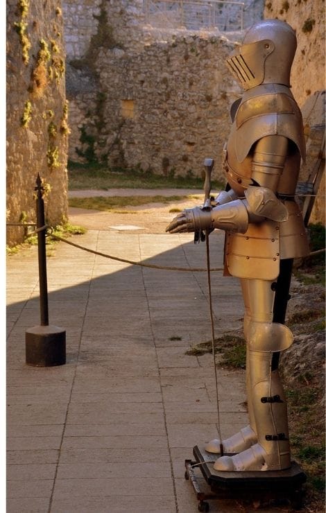 In Castel Sant’Angelo’s stone courtyard, a suit of armor stands watch—quiet, steady, timeless.