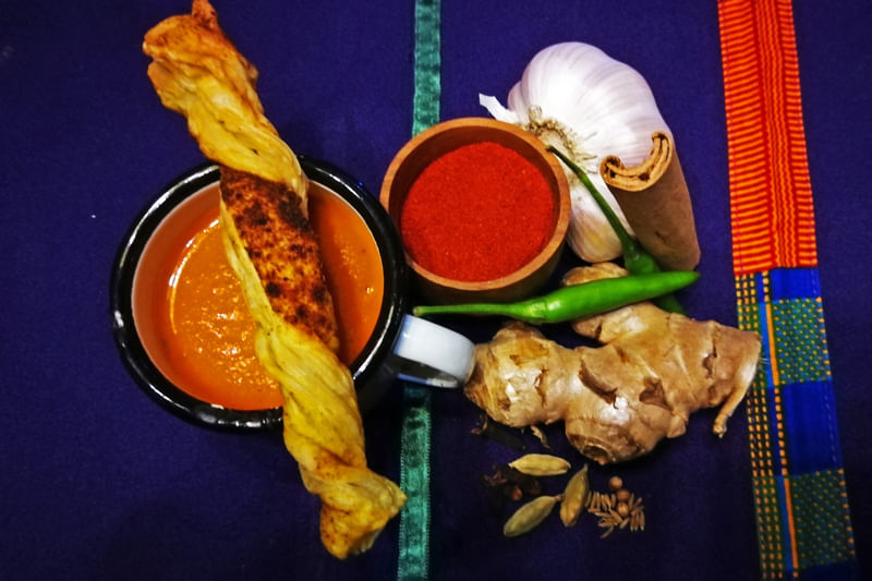 Table display of spice bowls and ingredients for the Spice Experience at Gold Restaurant Cape Town.
