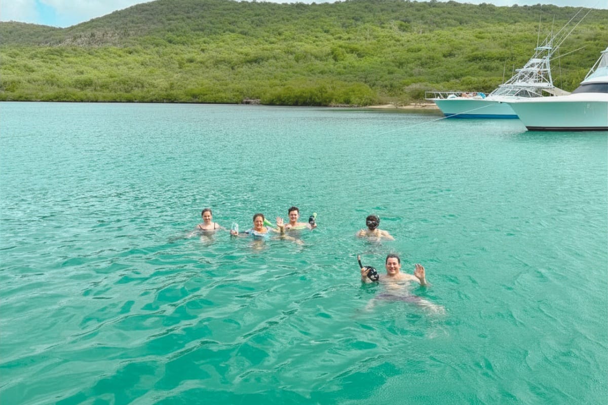 Family enjoying snorkeling at Fuik Bay by Maxie Sailing in Curacao