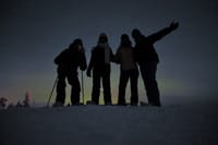 Snowshoeing Under the Auroras 1