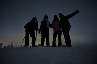 Snowshoeing Under the Auroras