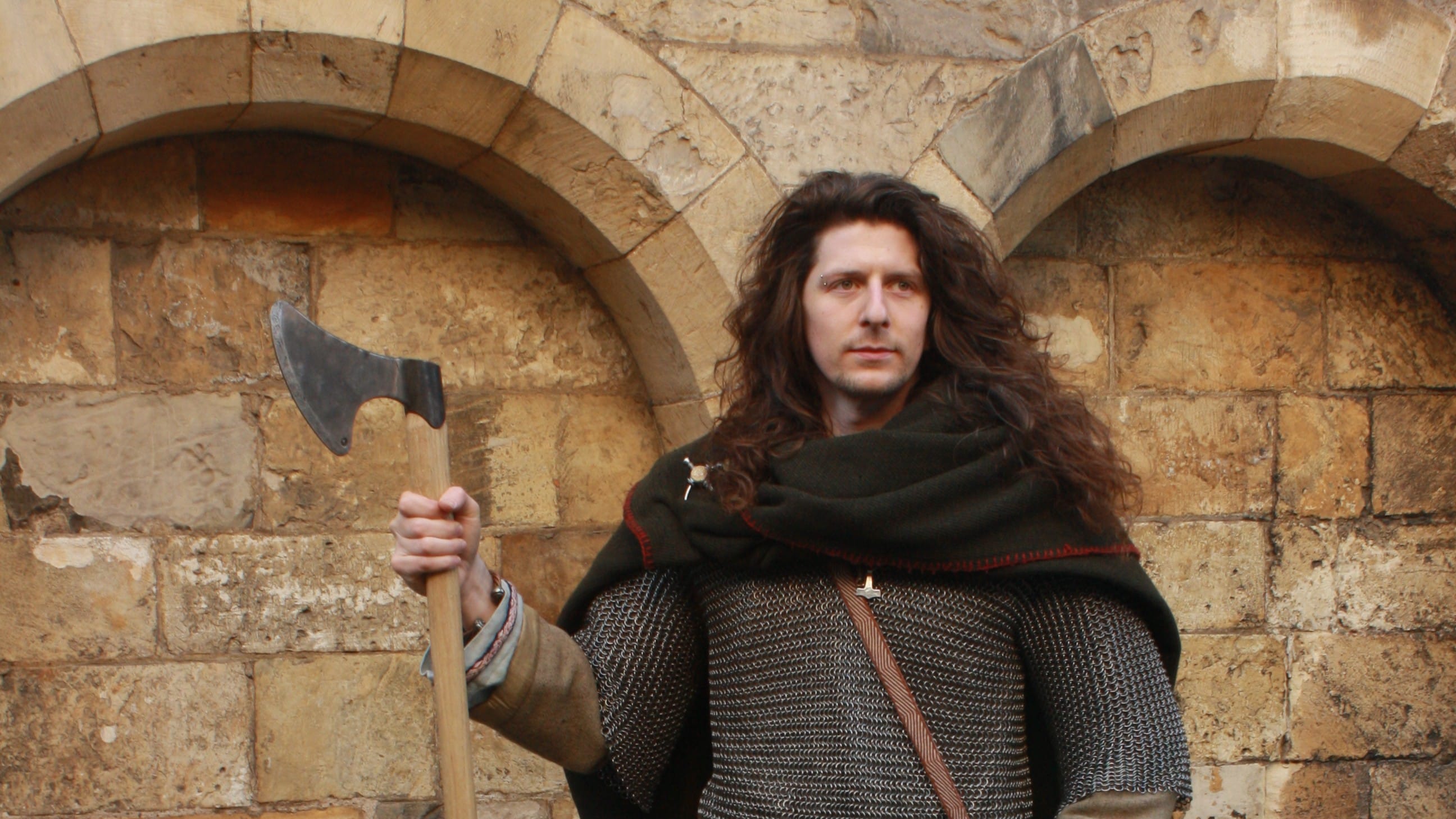 A viking warrior in a chain shirt, holding a large Dane axe.