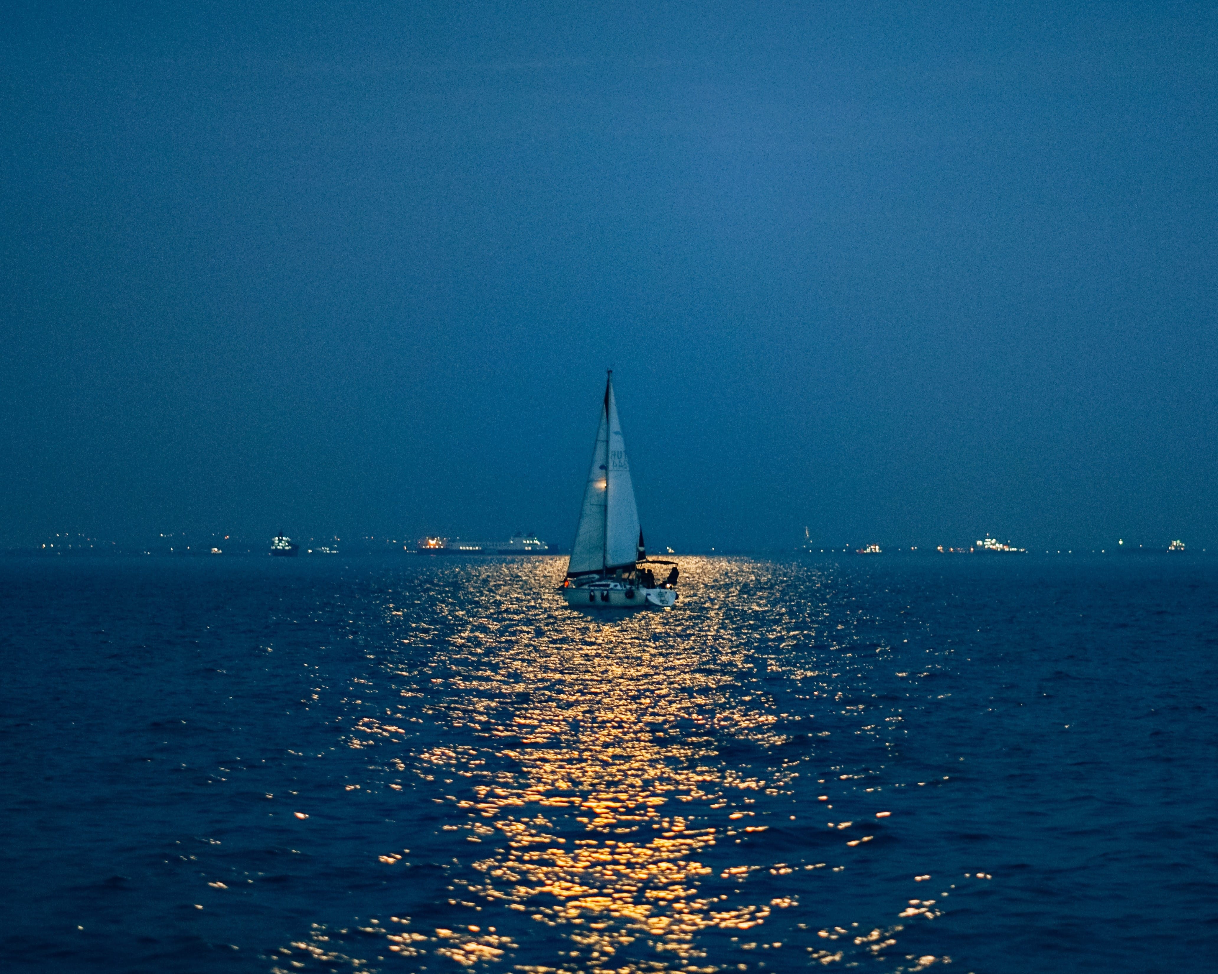 cover image of the 2.5h Full Moon sailing experience in Sotogrande Boat floating above the flash and unfurling sails