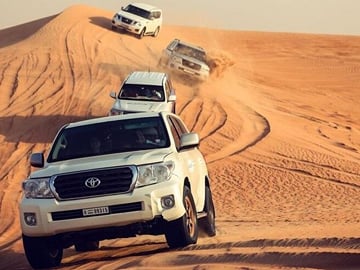 Dubai Desert Safari, Dune Bashing, Camel Ride, Sandboarding & BBQ