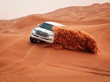 Dubai Red Dune Desert Safari with Camel Ride & BBQ Dinner