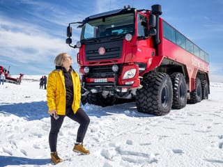 Stand in front of the massive red Monster Truck!