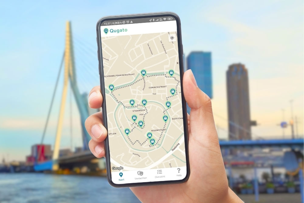 Phone showing the Qugato app interface of the Rotterdam City Detective game at Erasmusbrug.