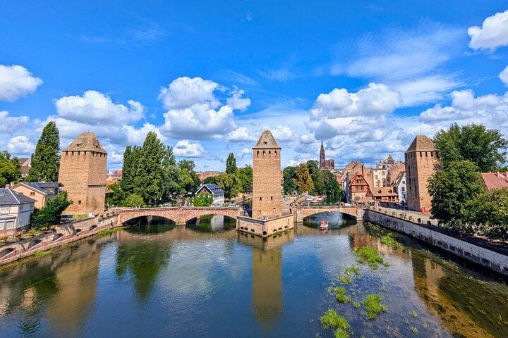 Panoramic view from the Vauban Dam, showing the three towers of the Covered Bridges and the Strasbourg Cathedral.